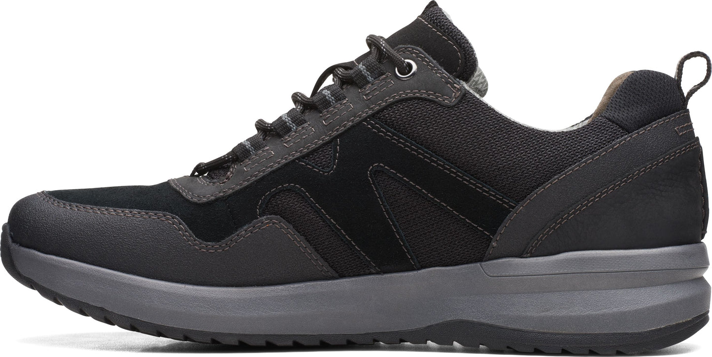 A low-profile black and gray shoe with dark laces and a sturdy gray sole.