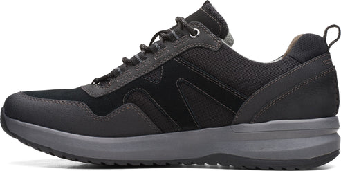 A low-profile black and gray shoe with dark laces and a sturdy gray sole.
