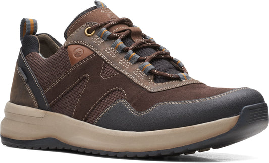 A brown and tan hiking shoe with dark gray trim and striped laces.