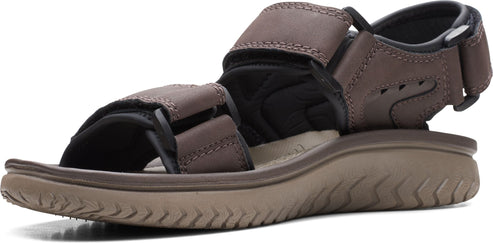 A brown sandal with velcro straps.