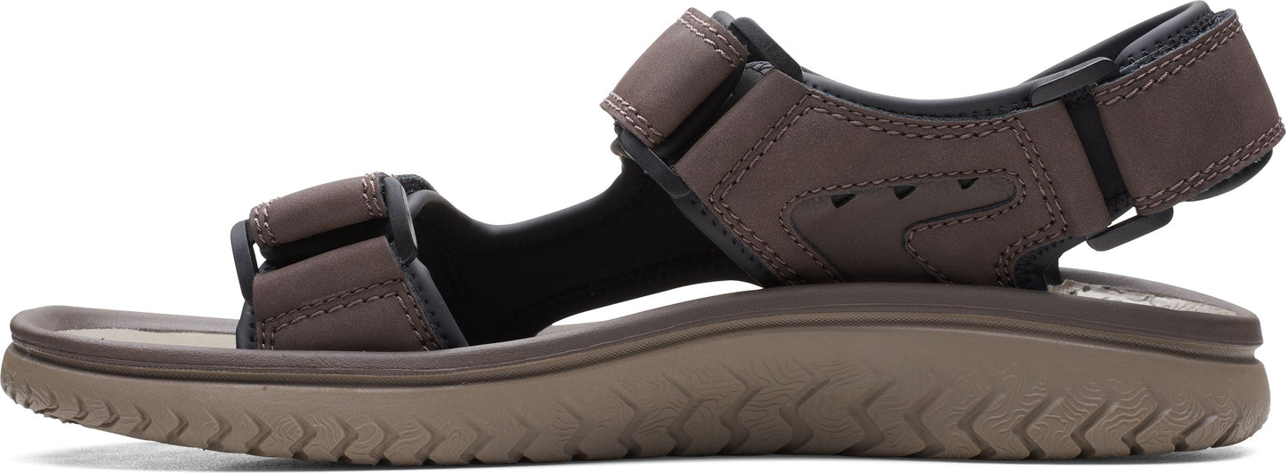 A brown sandal with two straps and a thick sole.