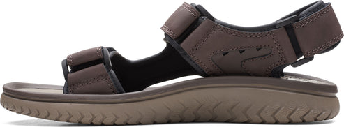 A brown sandal with two straps and a thick sole.