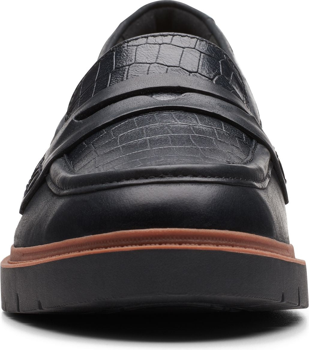 Black penny loafer with a crocodile pattern.