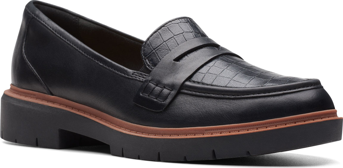 Black loafer with a lug sole and croc-embossed upper.