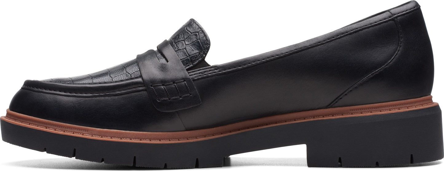 A black loafer with a thick sole.