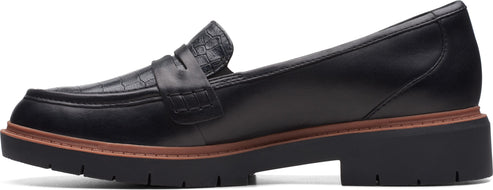 A black loafer with a thick sole.