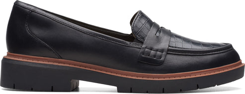 A black leather loafer with a lug sole.