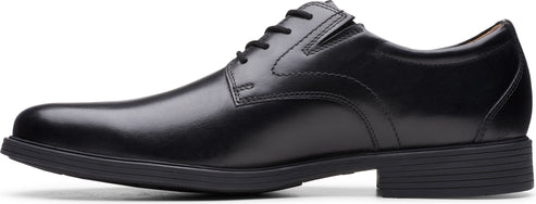 A black leather dress shoe with a lace-up closure and a low heel.