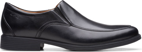 A black leather slip-on dress shoe with a low heel.