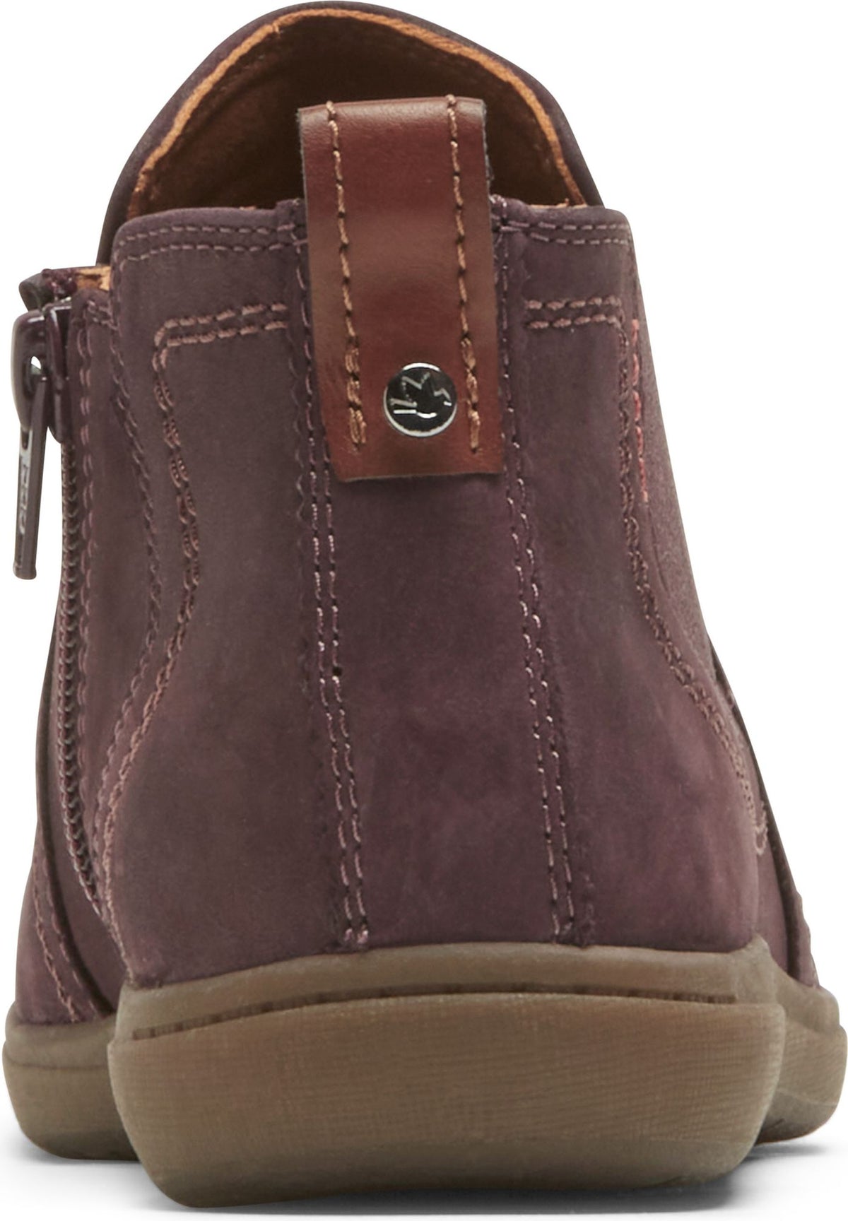 Back view of ankle-high boot with a zippered closure, a heel loop, a round toe, and decorative stitching.