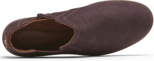 A brown leather slip-on shoe with a low heel.