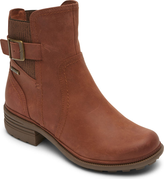 Brown leather ankle boot with side buckle and short stacked heel.