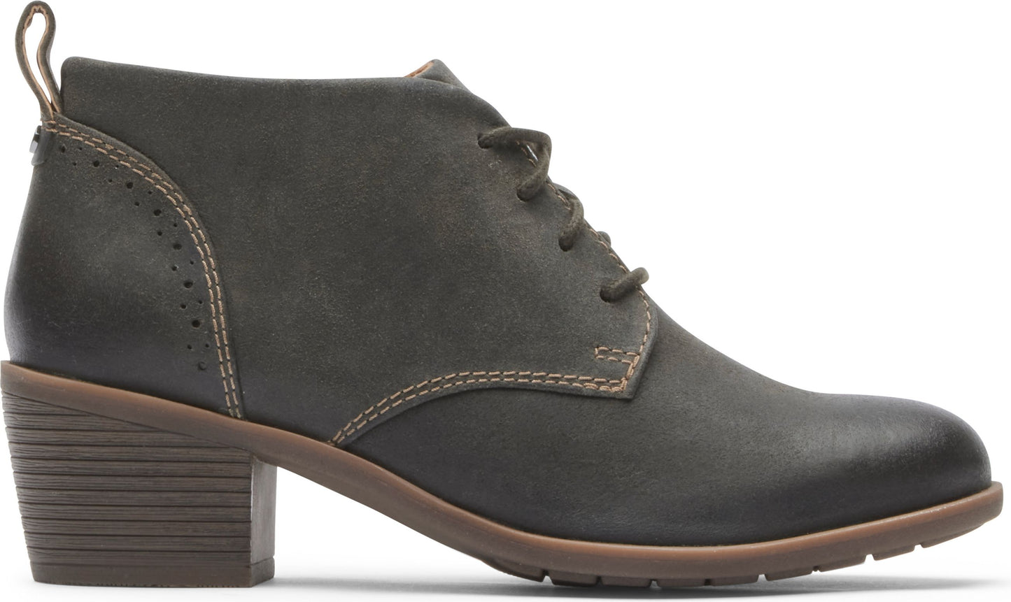 Olive leather heeled lace-up bootie with decorative perforations.