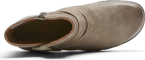 Taupe ankle boot with side zipper and wrinkled texture.