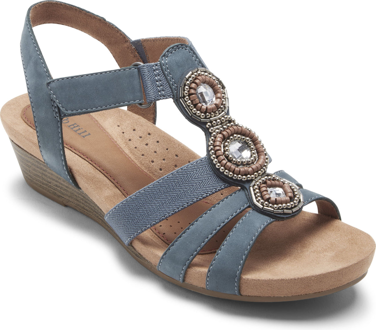 Blue sandal with jeweled detail, adjustable ankle strap and a low wedge heel.