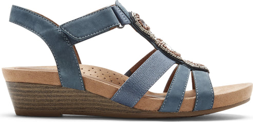 A blue sandal with straps and bead embellishments.