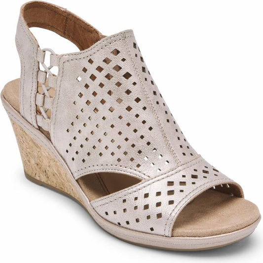 A beige wedge sandal with a peep toe and diamond-shaped perforations