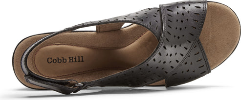 A black sandal with laser cut accents and an adjustable strap.