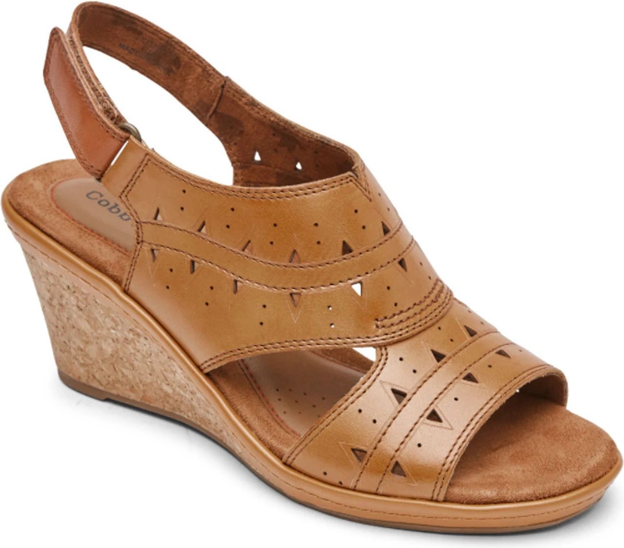 Tan wedge heel sandal with cutout details and a slingback strap.