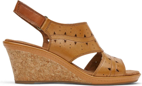 Tan leather sandal with cork wedge heel and triangle cutouts.