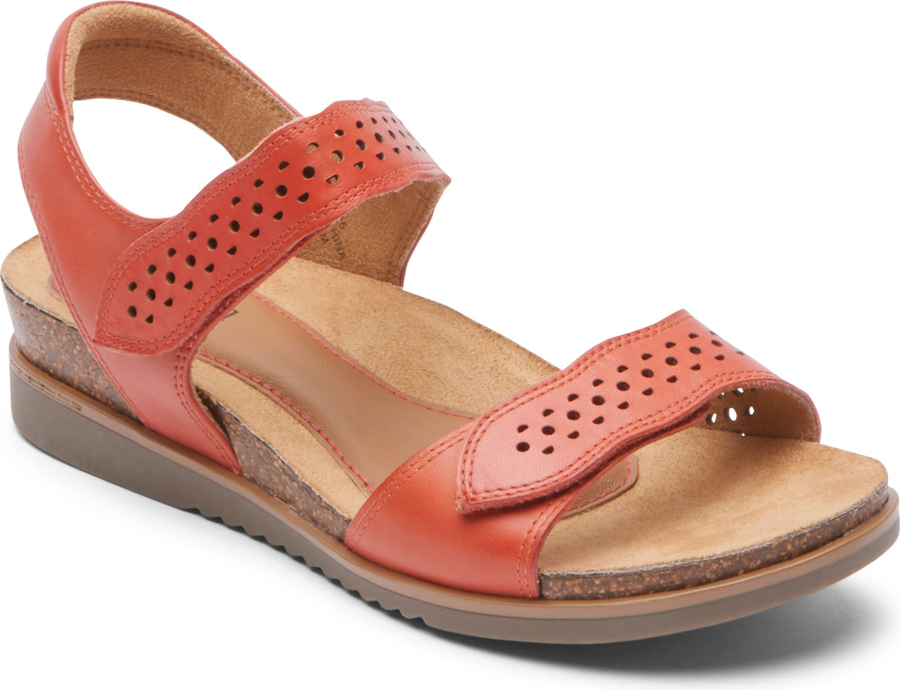 Burnt orange sandal with toe and ankle velcro straps featuring decorative perforations.