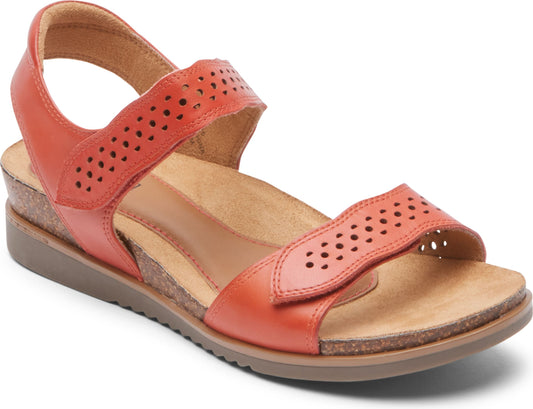 Burnt orange sandal with toe and ankle velcro straps featuring decorative perforations.