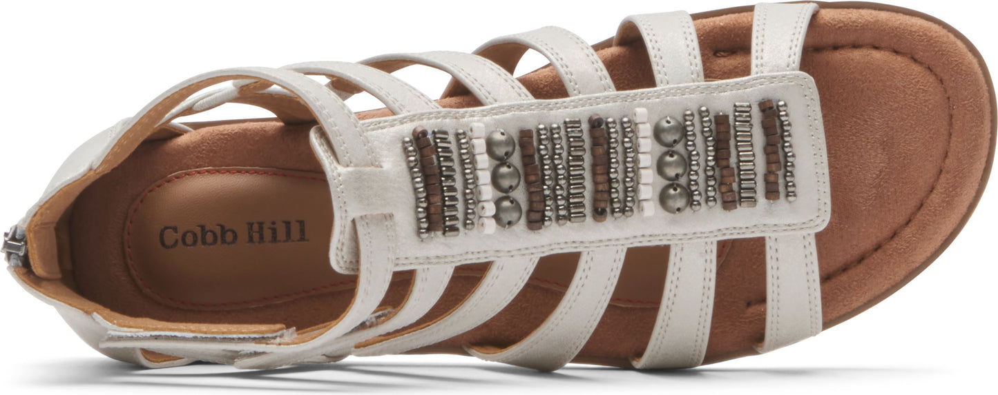 white sandals with multiple straps and beaded accents