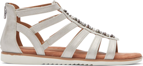 A woman's sandal with strappy design, embellished with small metal spheres, and a rear zipper.