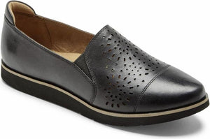 Black leather slip-on shoe with laser cutouts on the toe box and a low wedge heel.
