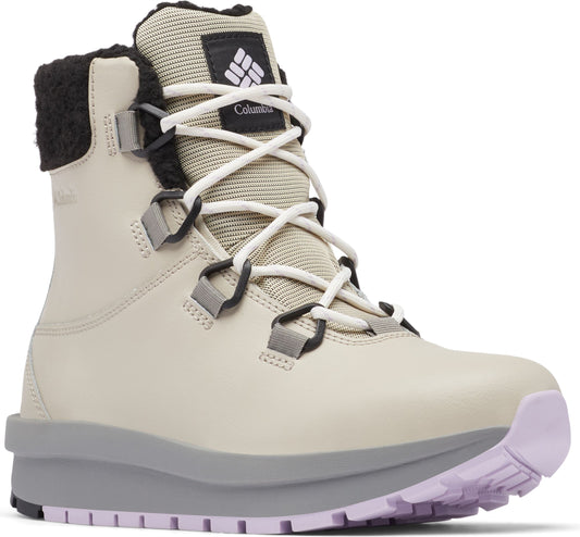 High top, light beige boot with white laces, black plush lining, logo and Columbia text on tongue, gray midsole, and light purple tread.