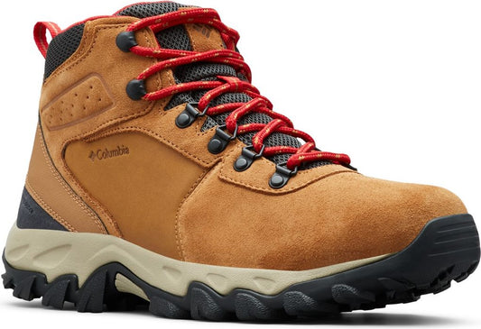 Tan hiking boot with red laces and black and beige sole.