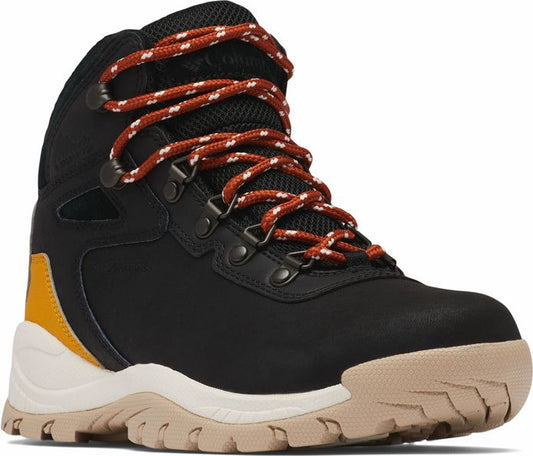 Black hiking boot with orange and white laces, mustard yellow accent, and light beige sole.