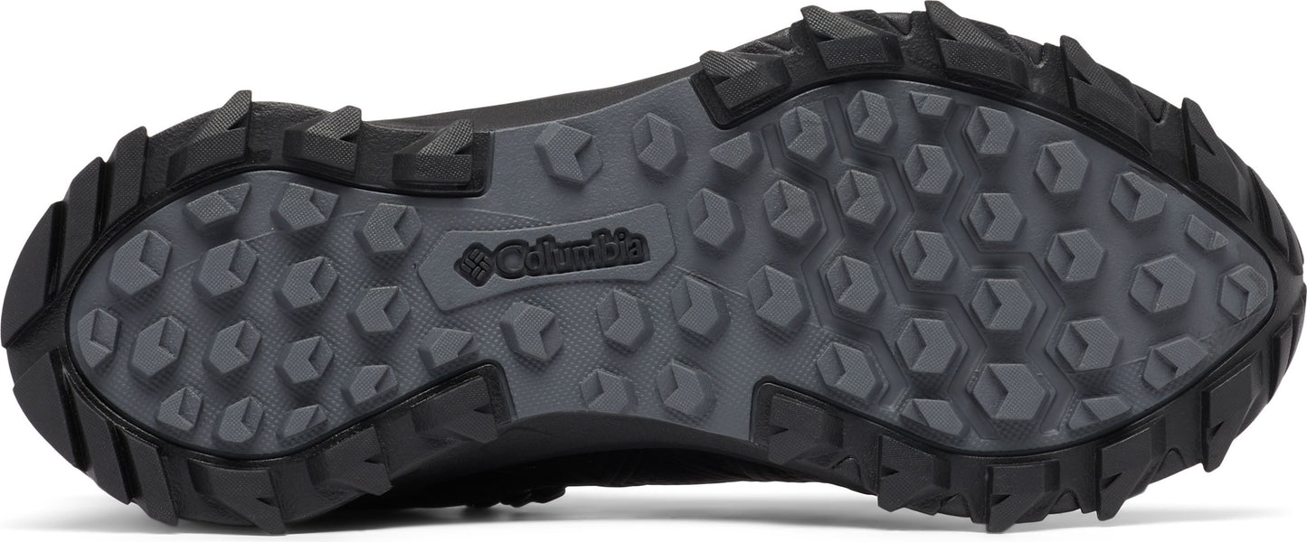 A dark shoe sole with a Columbia logo and multi-directional, hexagonal treads.