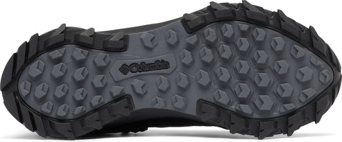 A dark shoe sole with a Columbia logo and multi-directional, hexagonal treads.