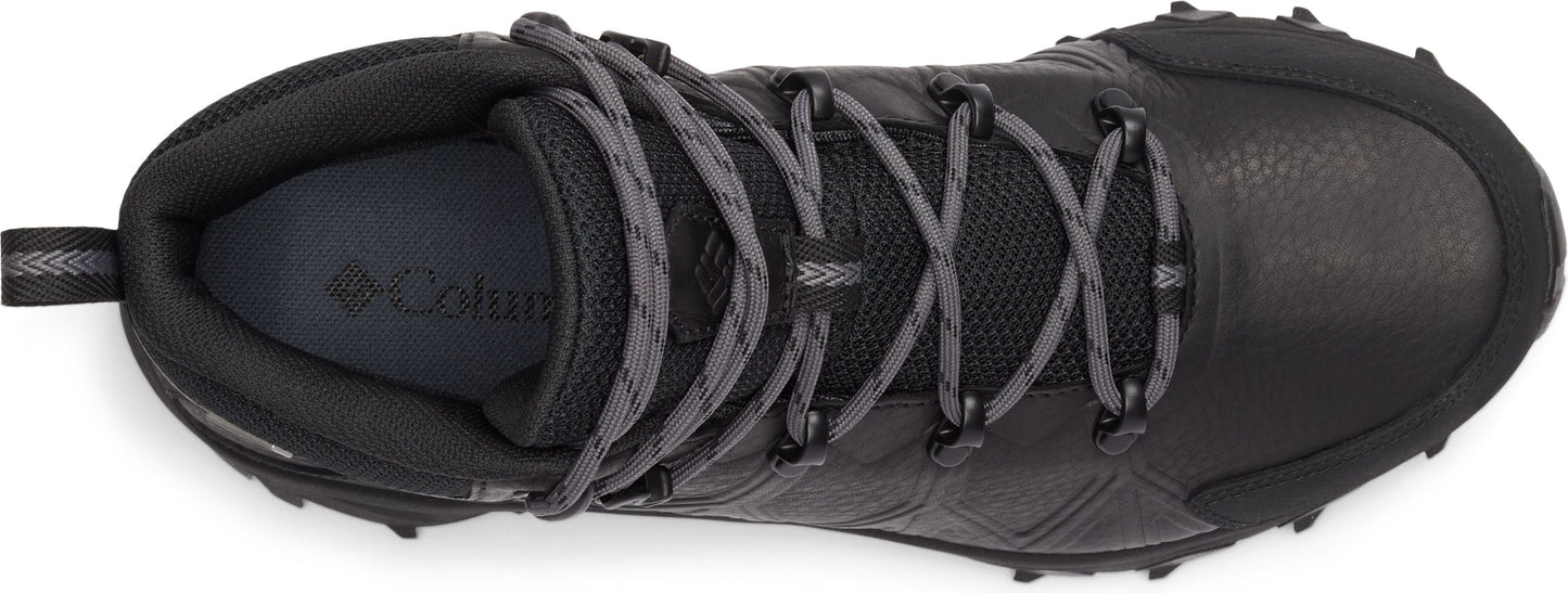 Top-down view of a black boot with gray laces.