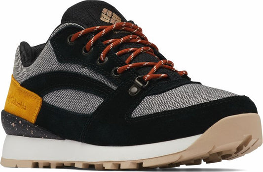 Low-rise hiking shoe with black suede paneling, herringbone fabric, orange laces, yellow heel detail, white midsole and beige outsole.