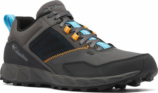 Gray low-top hiking shoe with blue and orange laces and a black mesh panel.