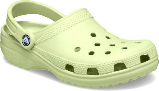 Light green clog with round ventilation holes, pivoting heel strap, and textured sole.
