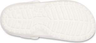 Close-up of the bottom of a white shoe revealing its textured sole.