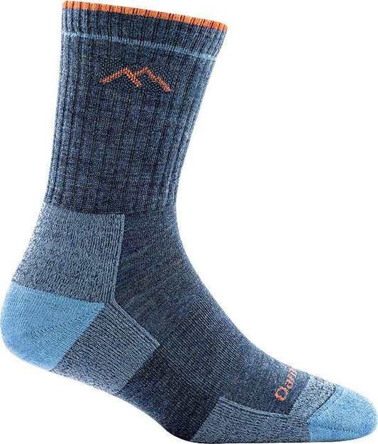 A blue cushioned crew sock with a mountain logo.