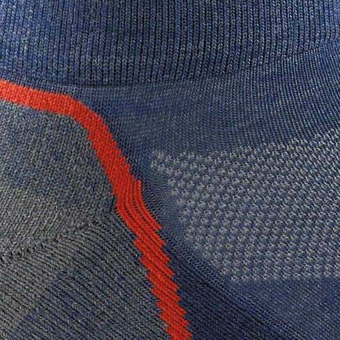 Close up of a blue-grey sock with a diagonal red stripe and a ventilated pattern.