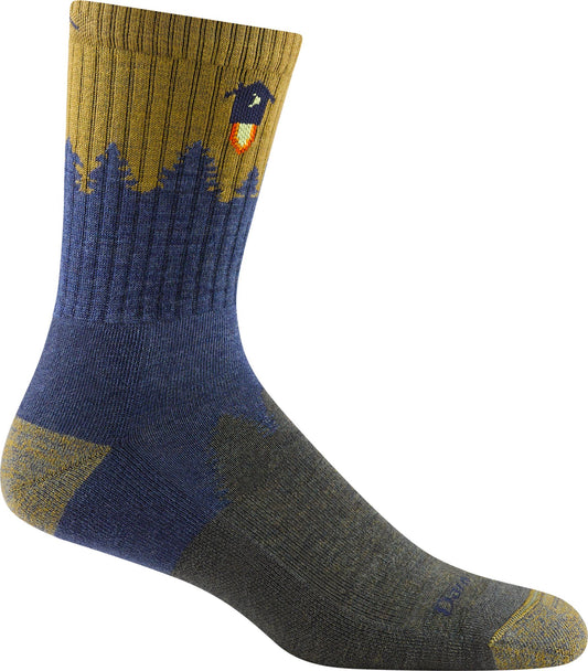 A crew sock with a yellow top with a tree line with a blue sky over it and a rocket shooting over the treeline; the foot is gray.