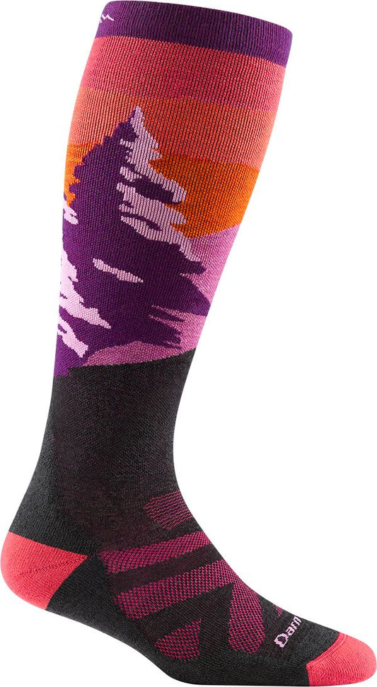 Knee-high sock featuring a purple mountain scene with a pine tree silhouette against an orange sunset.