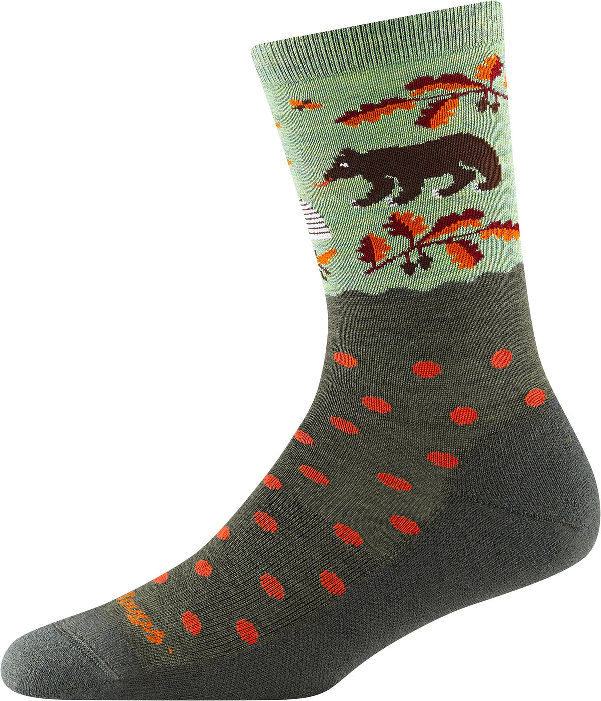 A crew sock, top band with a brown bear in an outdoor scene, below a dark green fabric with red dots, ending in a dark green toe.