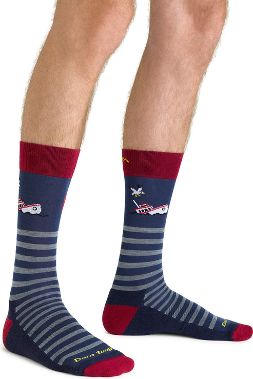 Pair of navy crew socks with red heels and toes, red top, gray horizontal stripes, and embroidered airplane designs.
