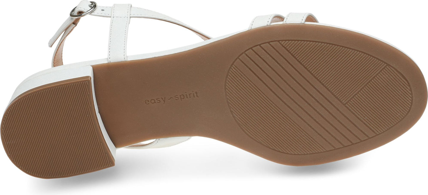 White sandal showing the brown textured sole.