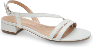 White sandal with thin straps, block heel, and adjustable ankle strap.