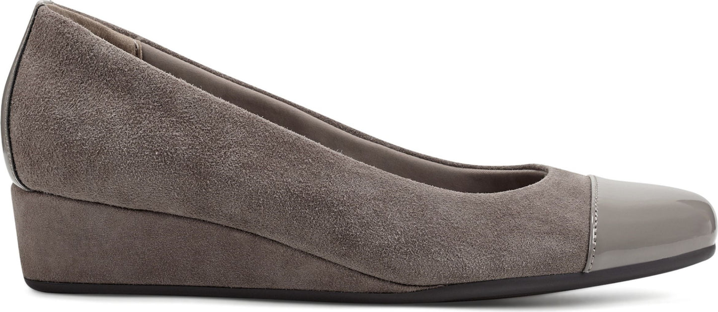 Gray suede wedge heel shoe with patent leather toe cap.