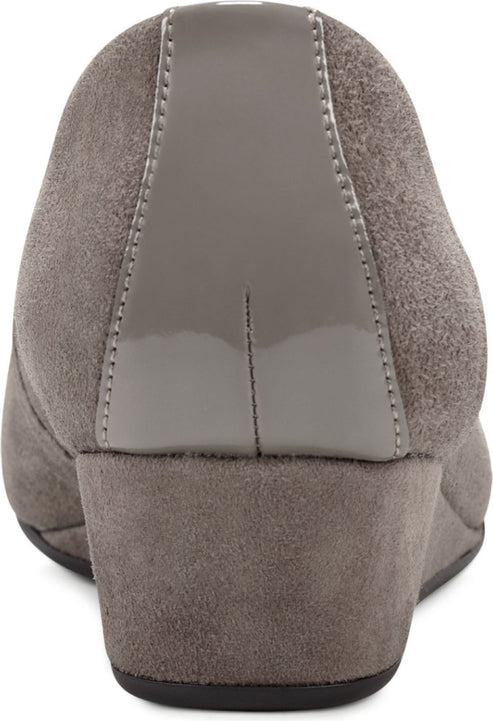 Back of grey suede wedge heel shoe with glossy grey accent.