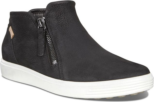 Black leather ankle boot with a side zipper and white sole.